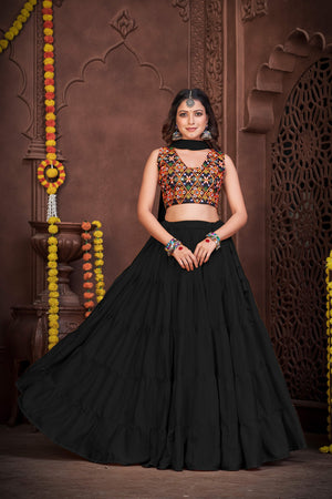 Black French Crape Navratri Lehenga Choli with multi-color Kutchi embroidery and mirror work blouse by The Beauty Queen