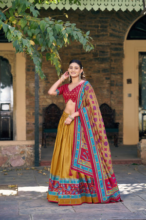 Mustard and Maroon Tasar Silk Navratri Lehenga Choli featuring iconic sparkle and peacock printed work by The Beauty Queen