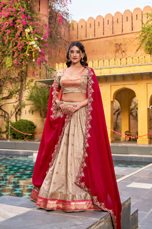 Zari woven gold lehenga with rani pink dupatta