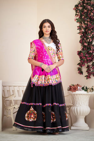 Black Georgette Navratri Lehenga Choli featuring traditional Kutchi embroidery, mirror work, and a vibrant pink Bandhani dupatta by The Beauty Queen