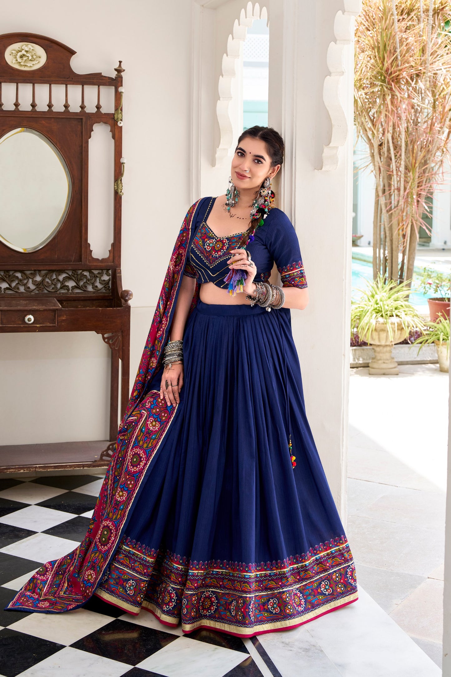 Navy Blue Tasar Silk Gamthi Print With Embossed Design Work Navratri Lehenga Choli
