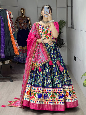 Navy floral printed lehenga with pink Patola dupatta and tassels