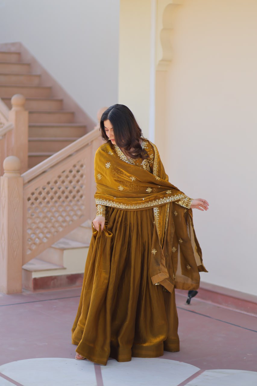 Mehandi Color Fendy Fabric With Zari Sequins Embroidered Work Gown