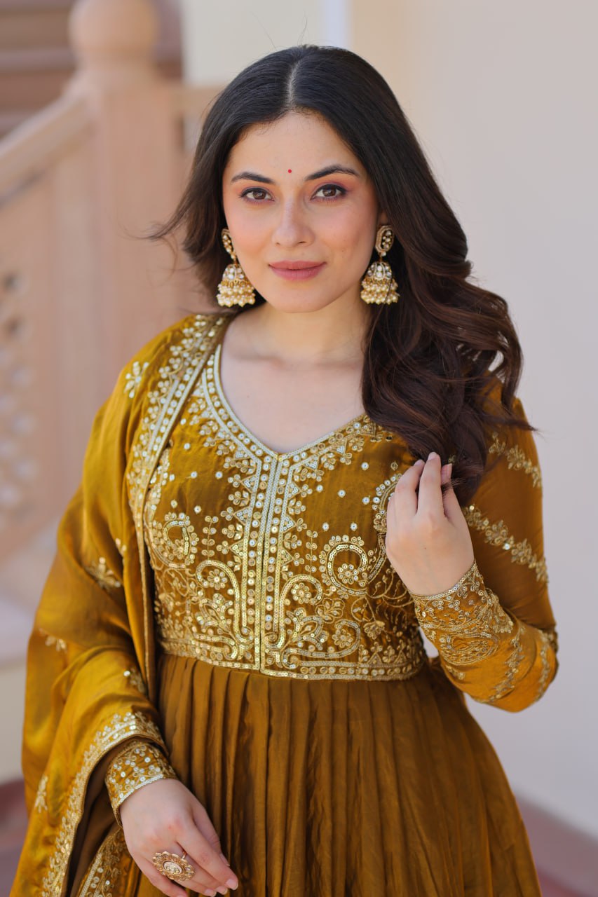Mehandi Color Fendy Fabric With Zari Sequins Embroidered Work Gown