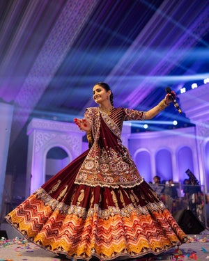 Maroon and orange Navratri chaniya choli with mirror work