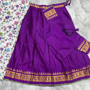 Purple South Indian half saree with temple patta border and off-white floral dupatta