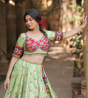 Pista green Navratri chaniya choli twirl with lampi lace border and pom pom dupatta