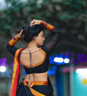 Traditional half saree with woven gold zari peacock motif border black red