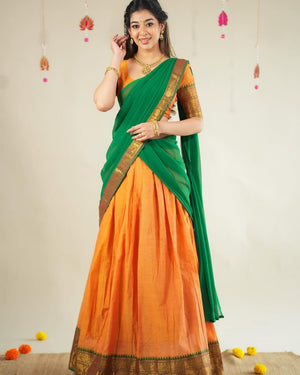 Orange and green Kanchi cotton half saree lehenga with gold zari temple border