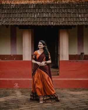 Traditional half saree with woven gold zari border orange maroon