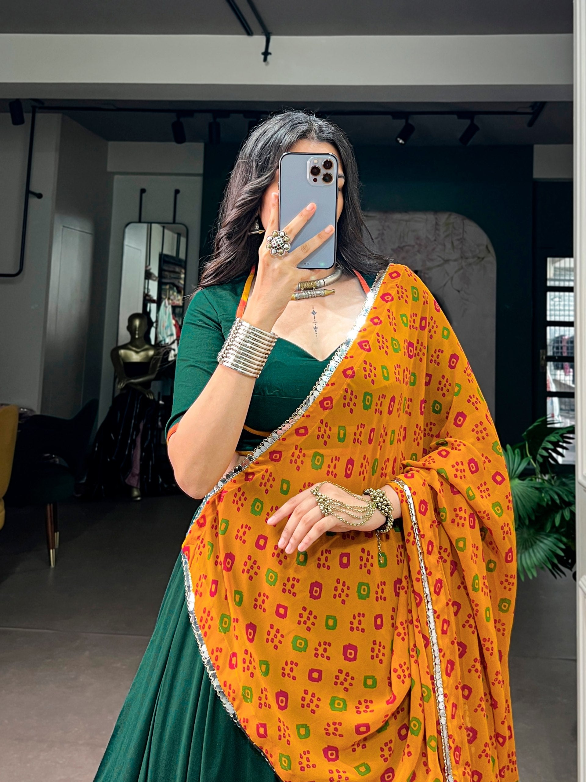 Bottle Green & Mustard Yellow Crafted In Soft Chinon Fabric, Enhanced With Embossed Design Lace Navratri Chaniya Choli Set