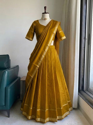 Tonal mustard half saree at temple architecture