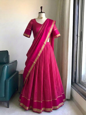 Tonal rani pink half saree at temple corridor