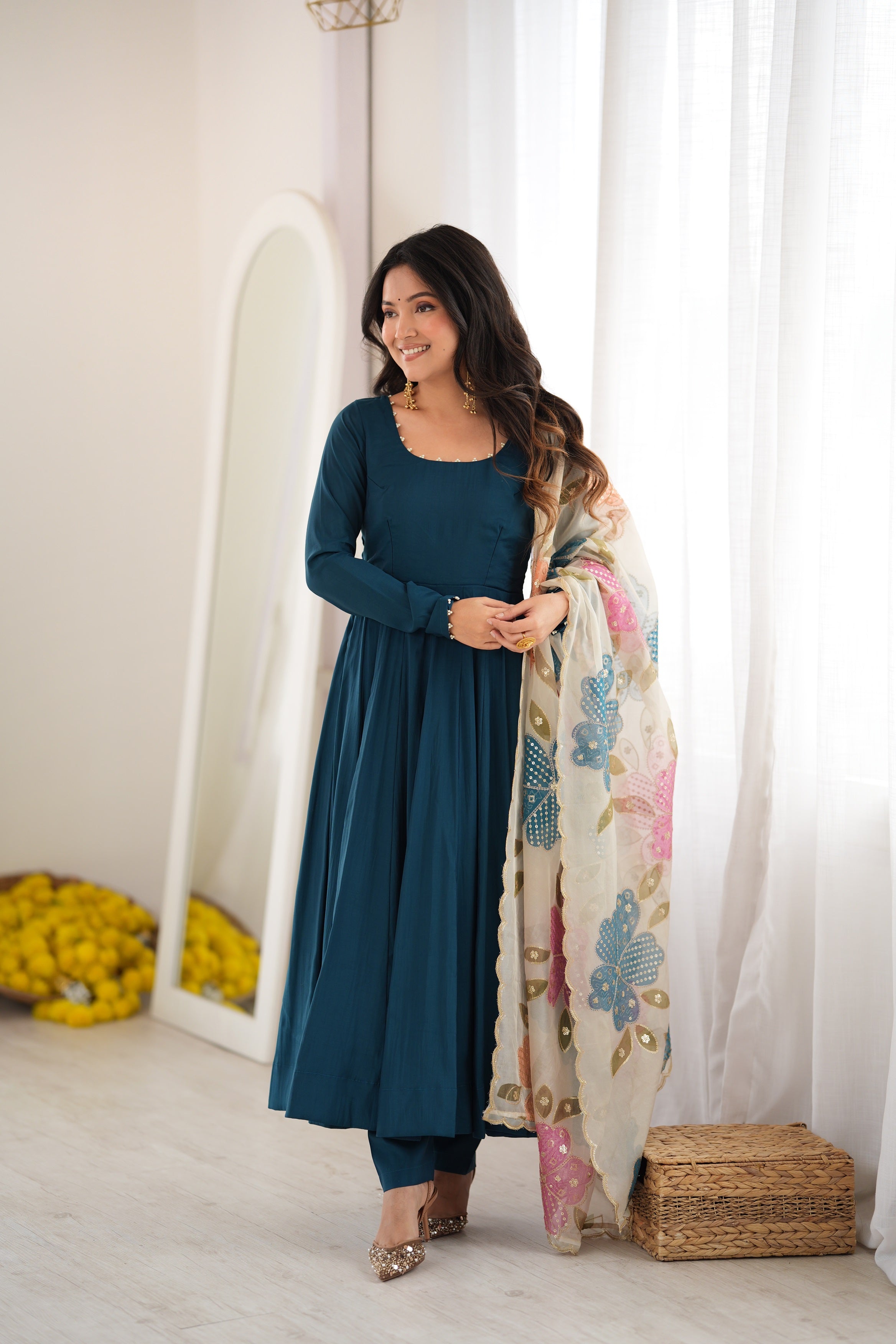 Peacock Teal Blue Heavy Pure Roman Silk Fully Flared Anarkali Gown Suit Set with Pearl Embroidered Neckline, Matching Pants & Multicolor Floral Appliqué Organza Dupatta