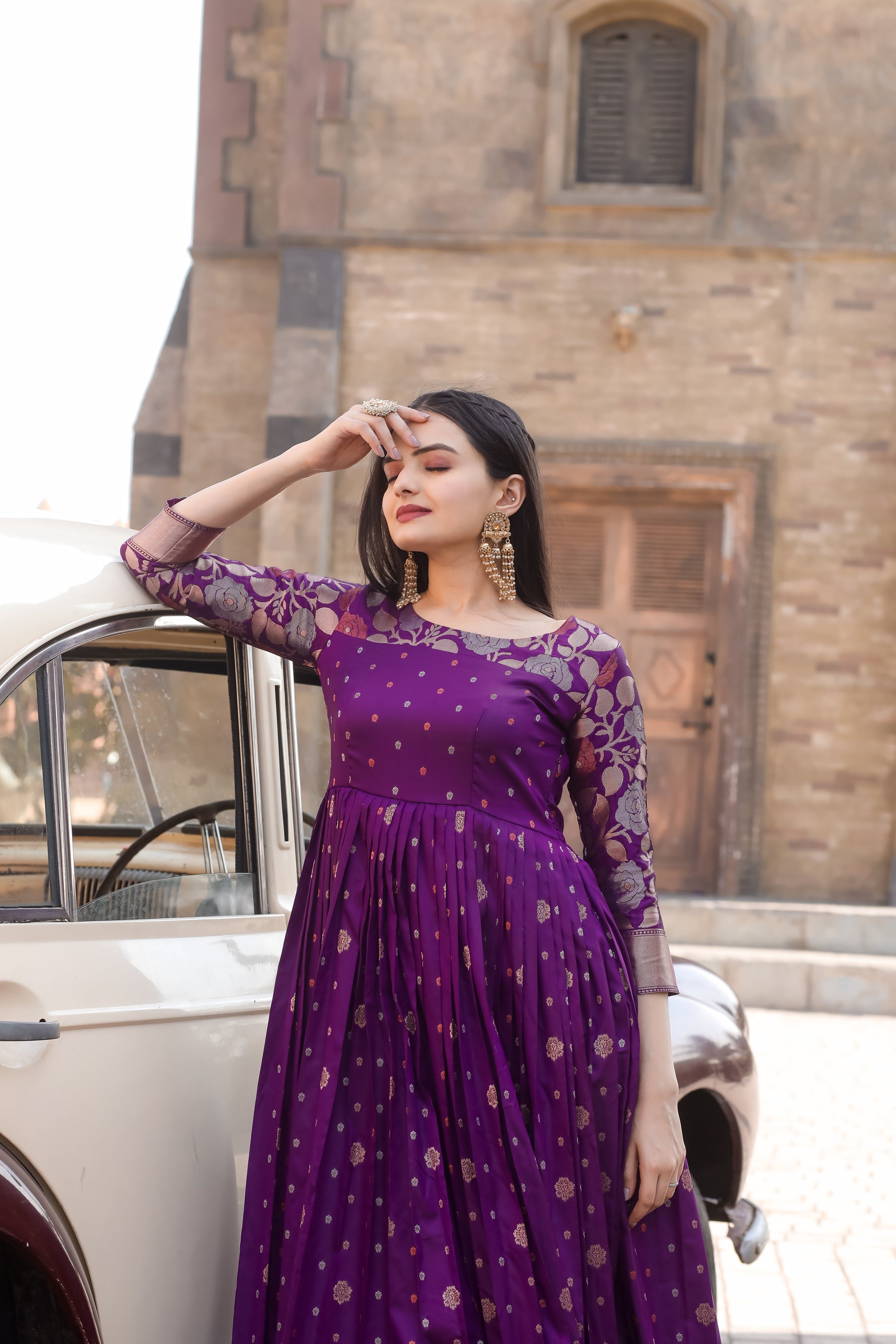Purple Soft Silk Flared Gown with All-Over Copper Zari Weaving Buttiss & Rich Floral Border