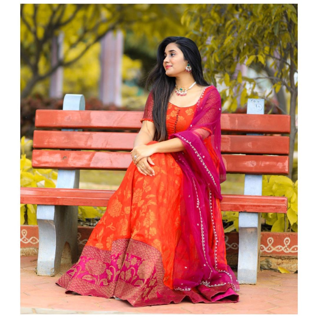 Orange Silk Gown With Jacquard Border And Net Dupatta