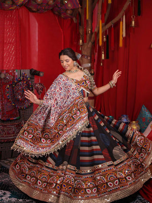 Model Posing In Multi-Color Striped Heavy Muslin Cotton With Real Mirror Work Navratri Lehenga Choli Set With White Printed Dupatta By The Beauty Queen