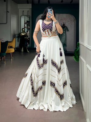 Model wearing Off-White & Purple Pure Rayon Elegance Enhanced With Heritage Prints And A Beautifully Crafted Gamthi Mirror Lace Blouse Navratri Lehenga Choli Set by The Beauty Queen