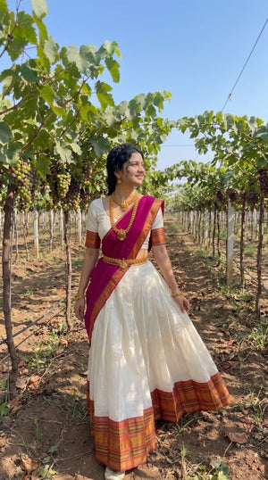 Off-White and Deep Rani Pink Mul Cotton Zari Weaving Work South Indian Half Saree Langa Voni Set flat lay view by The Beauty Queen