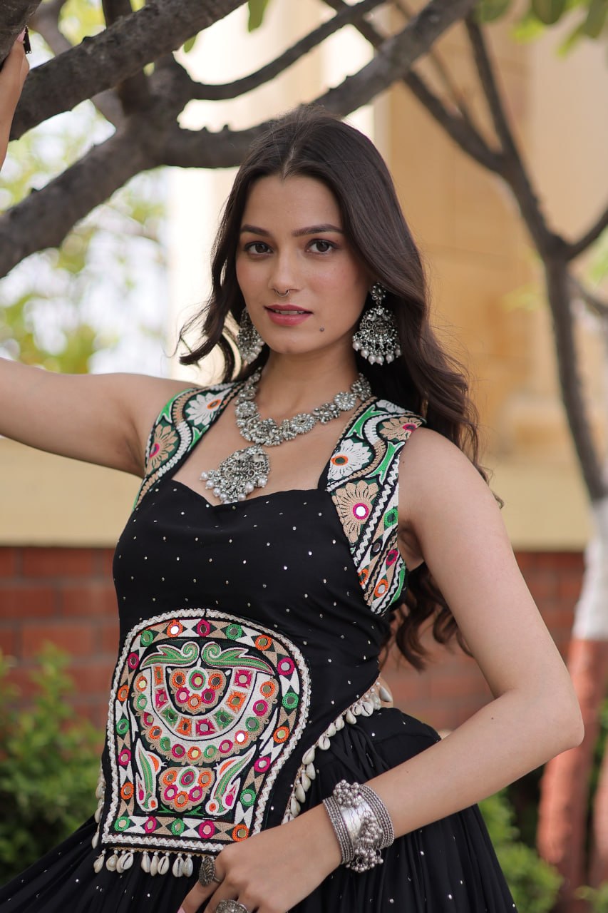 Jet Black 14kg Rayon Navratri Special Flared Lehenga Choli Set with Sparkling Mukaish (Badla) Work, Multi-Line Gota Patti Borders & Kutchi Embroidered Cowrie Shell Sleeveless Blouse