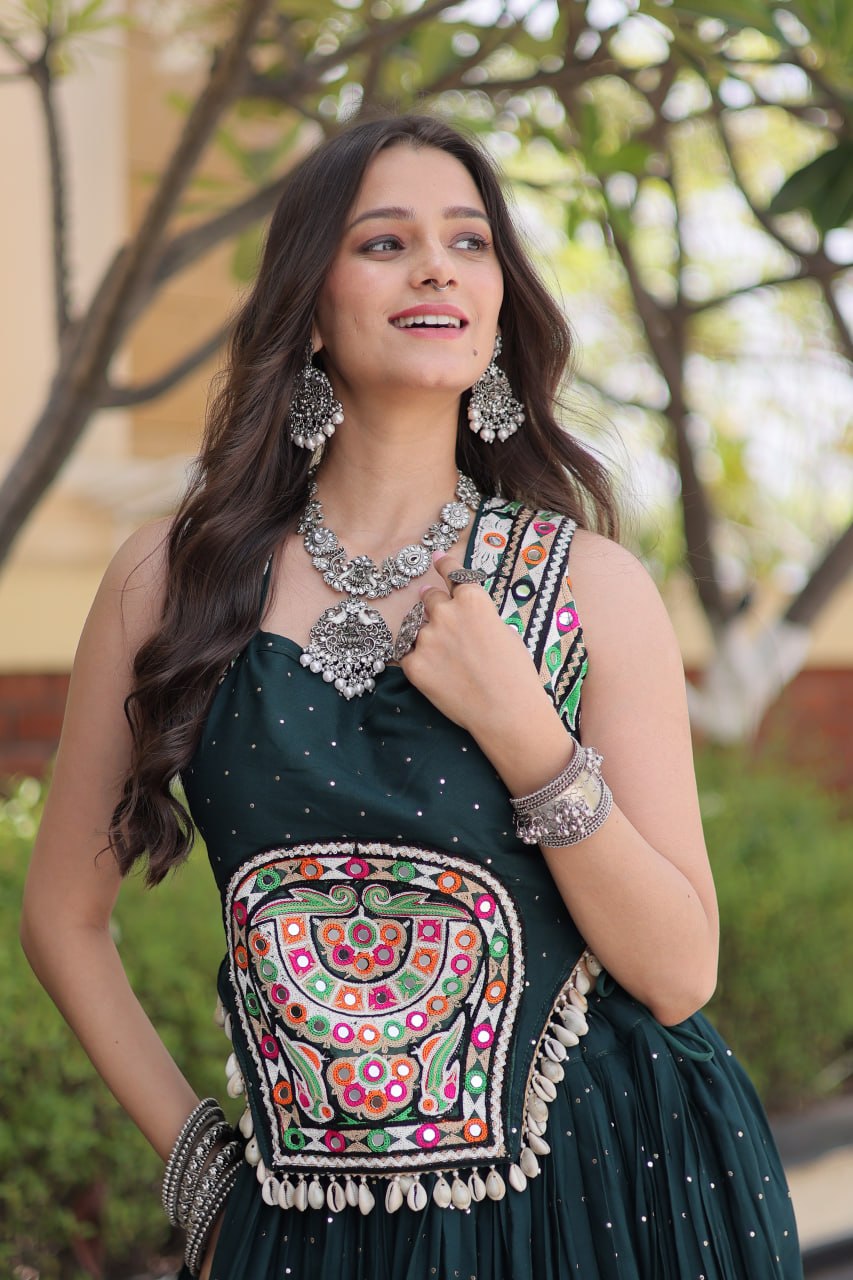 Teal Green 14kg Rayon Navratri Special Flared Lehenga Choli Set with Sparkling Mukaish (Badla) Work, Multi-Line Gota Patti Borders & Kutchi Embroidered Cowrie Shell Sleeveless Blouse