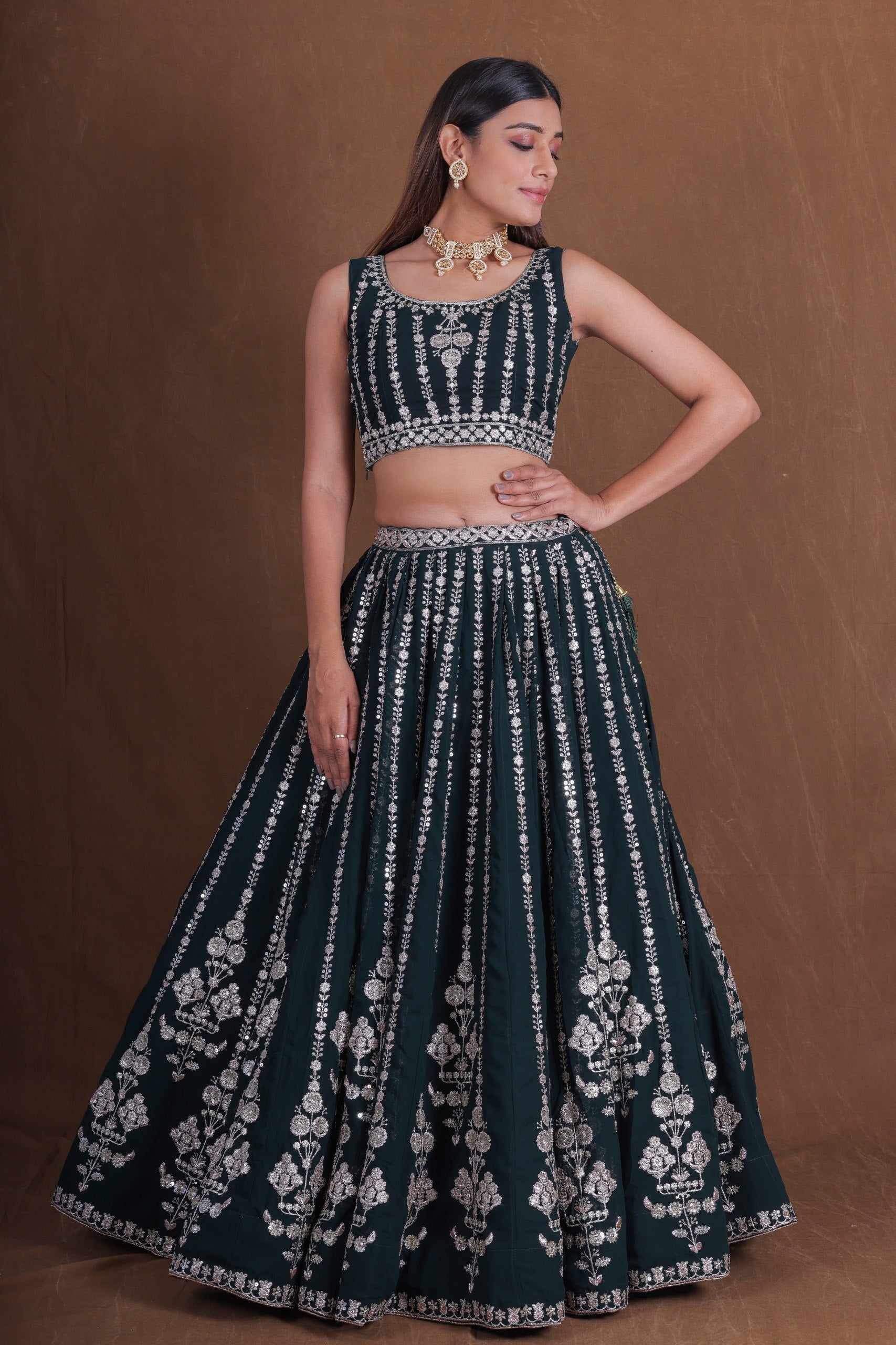Emerald Dark Green Georgette Flared Lehenga Choli Set with Rich Zari, Sequins & Thread Embroidery, Sleeveless Designer Blouse & Embroidered Sheer Net Dupatta