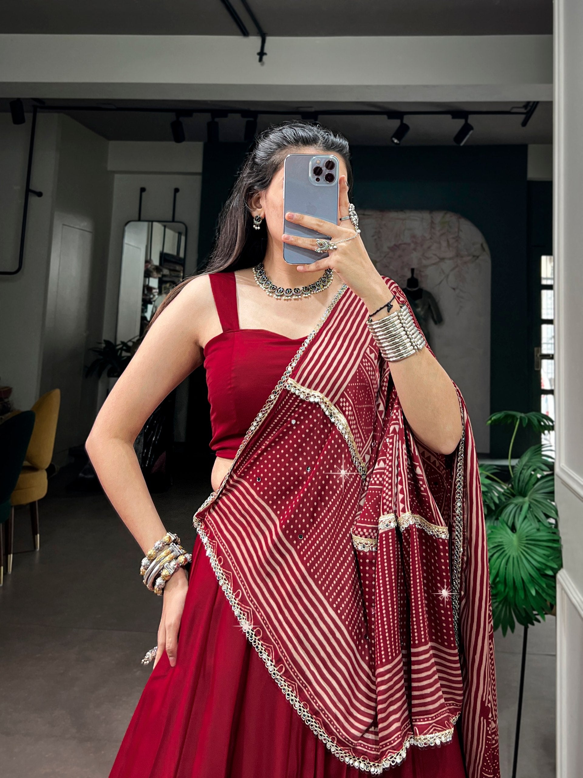Maroon Red Moonga Silk Navratri Special Flared Plain Lehenga Choli Set with Sleeveless Strappy Blouse & Geometric Bandhej Printed Satin Dupatta with Zari Lace Border