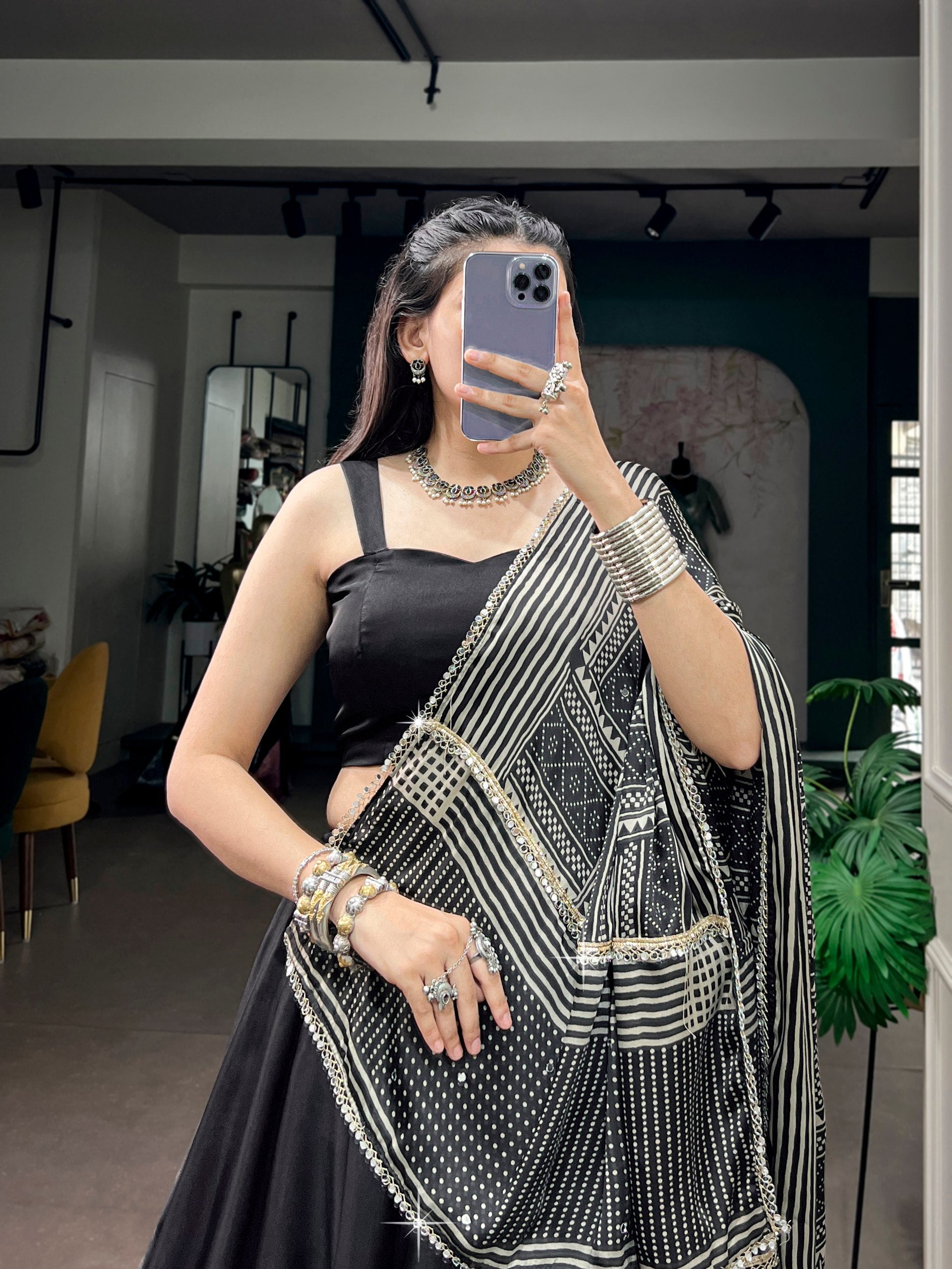Jet Black Moonga Silk Navratri Special Flared Plain Lehenga Choli Set with Sleeveless Strappy Blouse & Geometric Bandhej Printed Satin Dupatta with Zari Lace Border