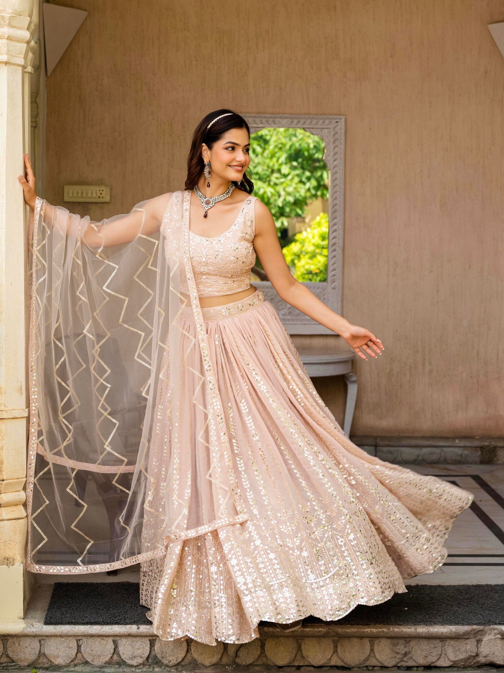 Dusty Rose Blush Pink Faux Georgette Flared Lehenga Choli Set with Rich Zari, Sequins & Floral Embroidery, Sleeveless Crop Blouse & Sheer Chevron Embroidered Dupatta