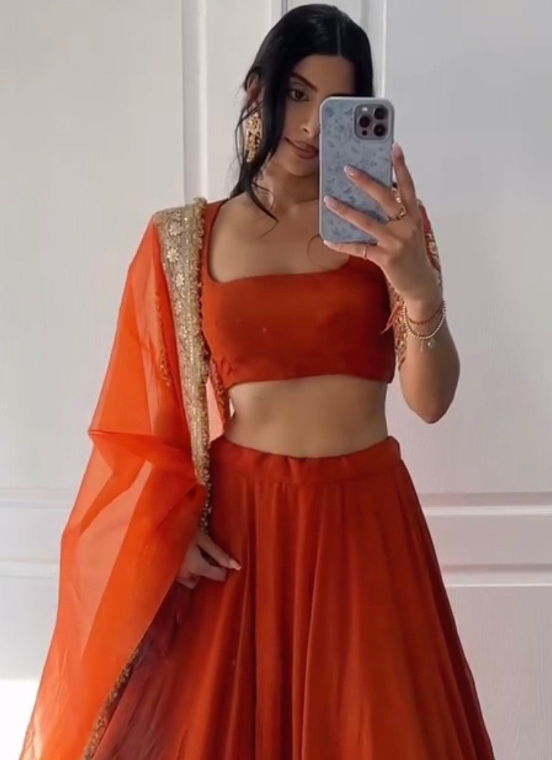Orange Rust Faux Georgette Embroidered Lehenga Choli With Zari & Sequins Border Work