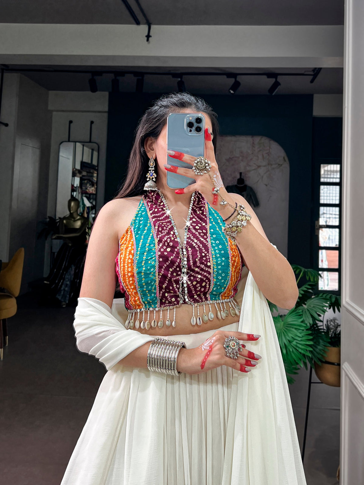 Off White Tiered Rayon Navratri Lehenga With Multi-Color Bandhani Print Halter Choli & Dupatta