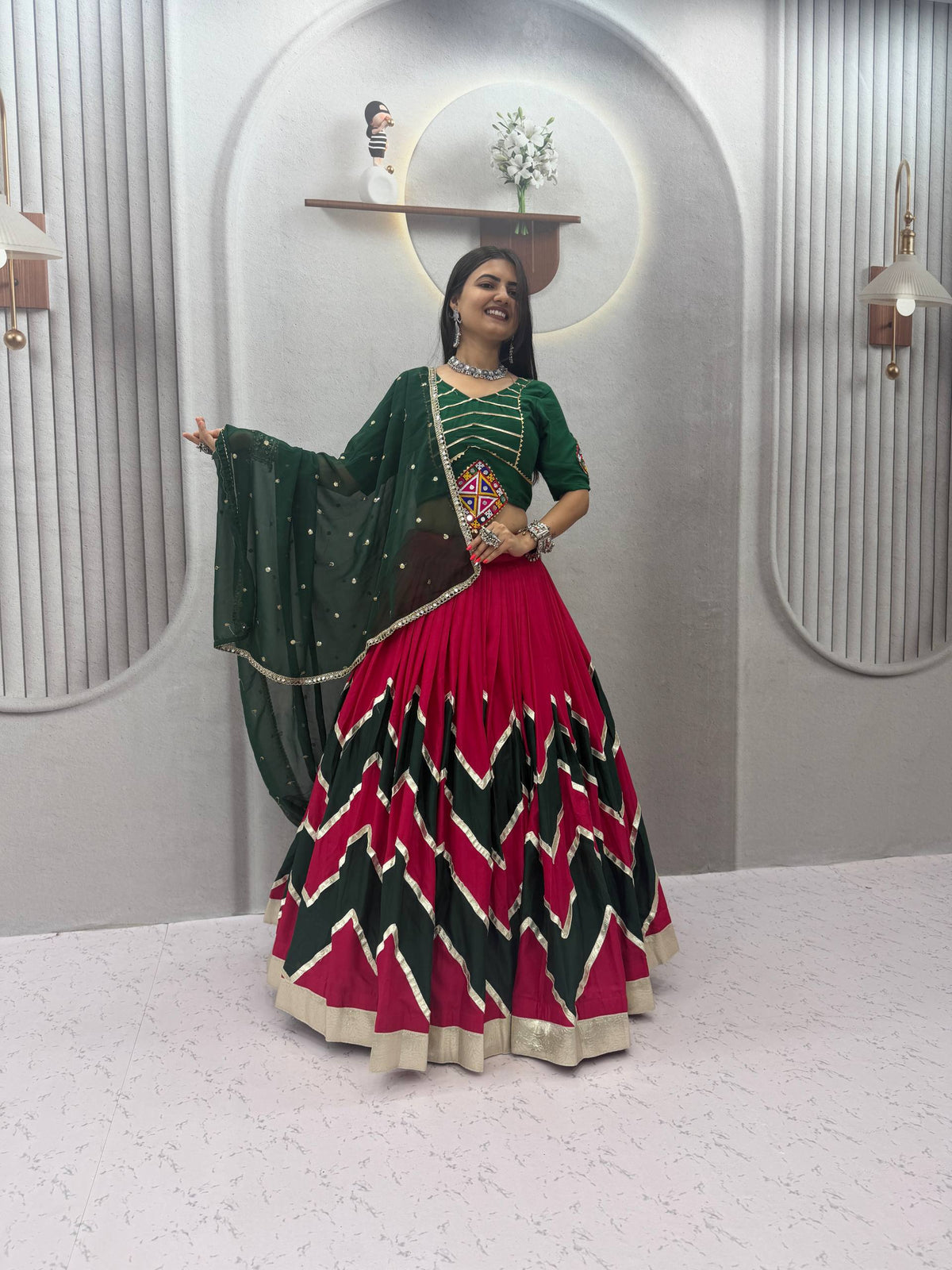 Rani Pink & Dark Green Rayon Cotton Zig-Zag Chevron Pattern Navratri Special Flared Lehenga Choli Set With Real Mirror Work Blouse & Dupatta