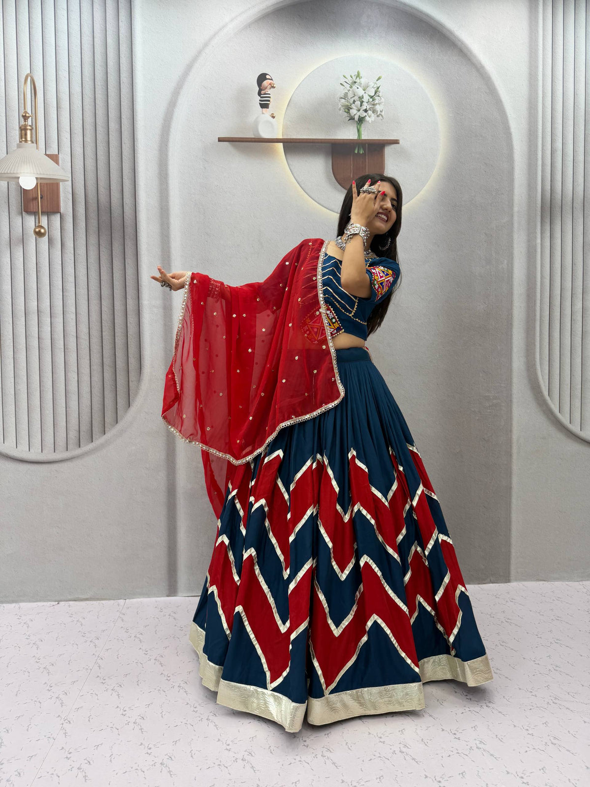 Navy Blue & Vibrant Red Rayon Cotton Zig-Zag Chevron Pattern Navratri Special Flared Lehenga Choli Set With Real Mirror Work Blouse & Dupatta