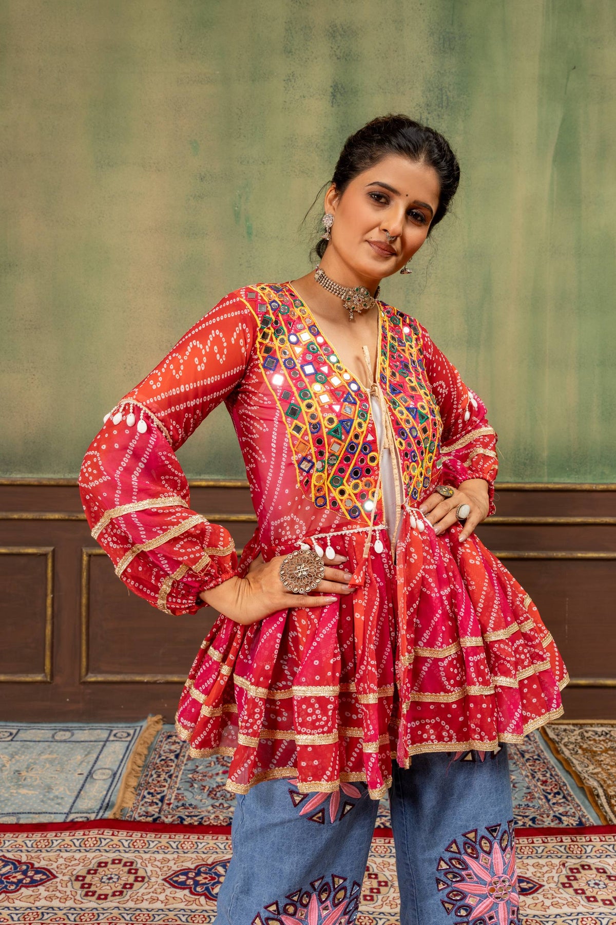 Red Faux Georgette Bandhani Print Ruffle Peplum Jacket With Real Mirror Work Embroidery & Embroidered Denim Jeans Navratri Fusion Set