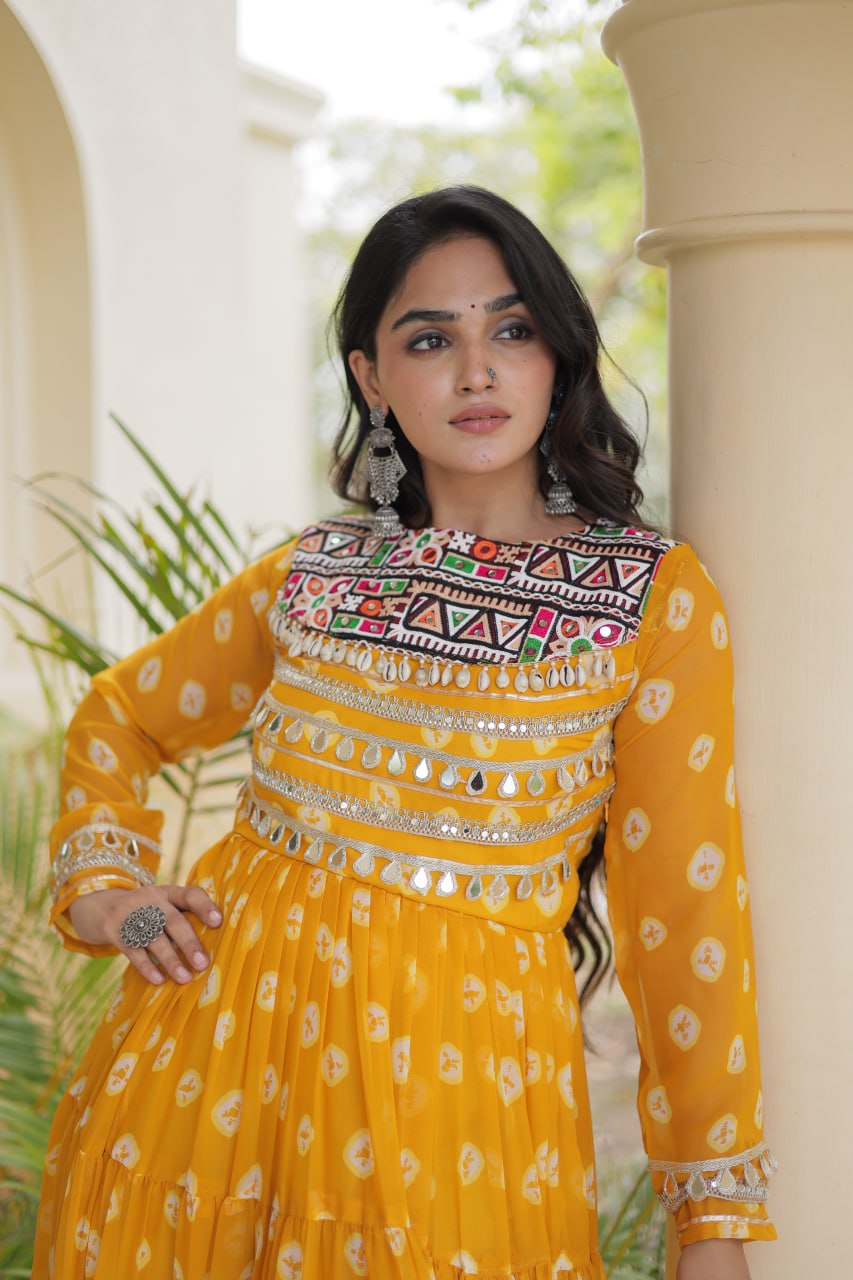 Mustard Yellow Bandhani Printed Faux Georgette Anarkali Gown With Kutchi Embroidered Patchwork & Mirror Work Detailing