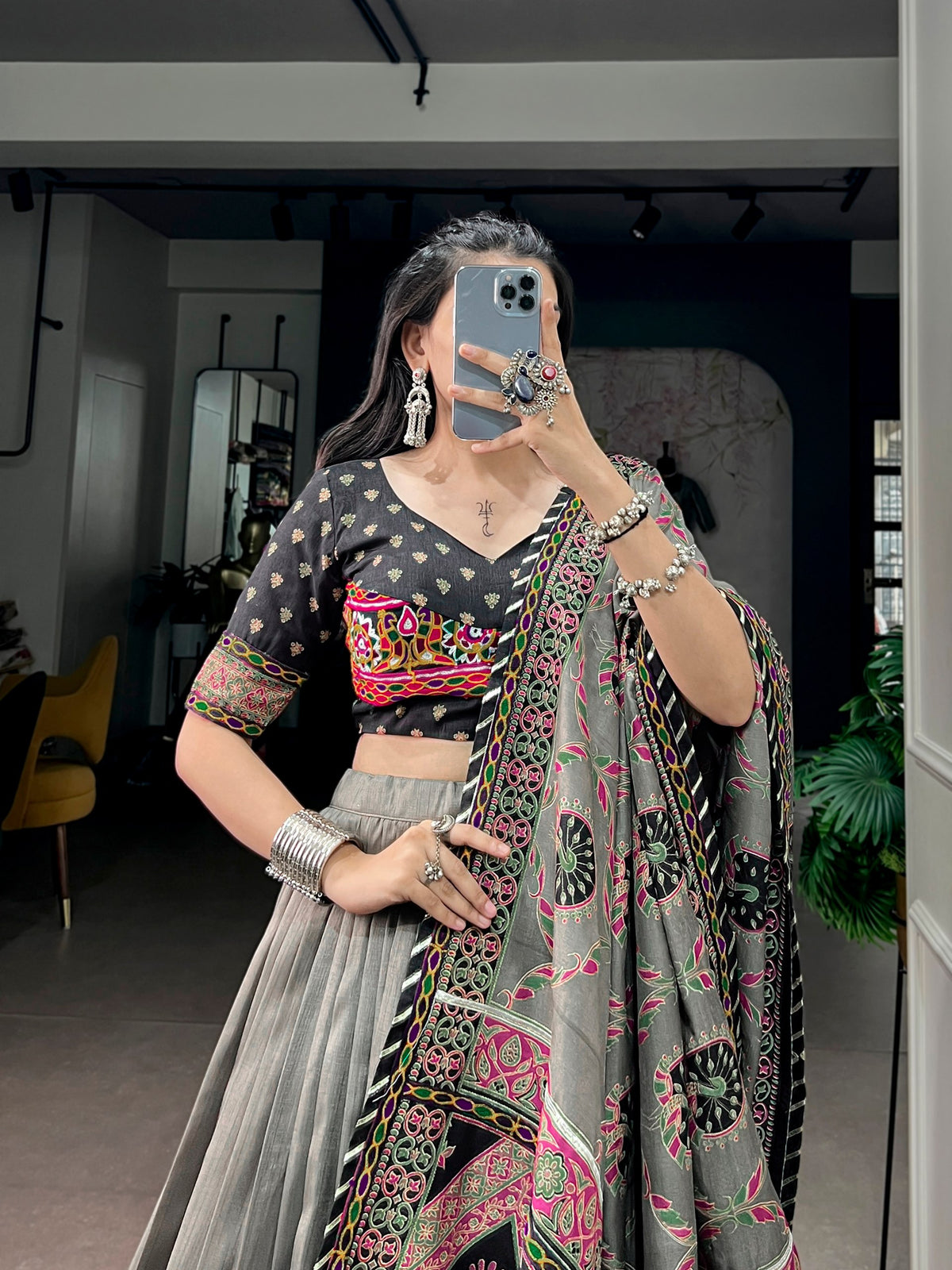Grey Tussar Silk Flared Navratri Lehenga Choli Set With Traditional Printed Gamthi Work Border & Black Backless Blouse