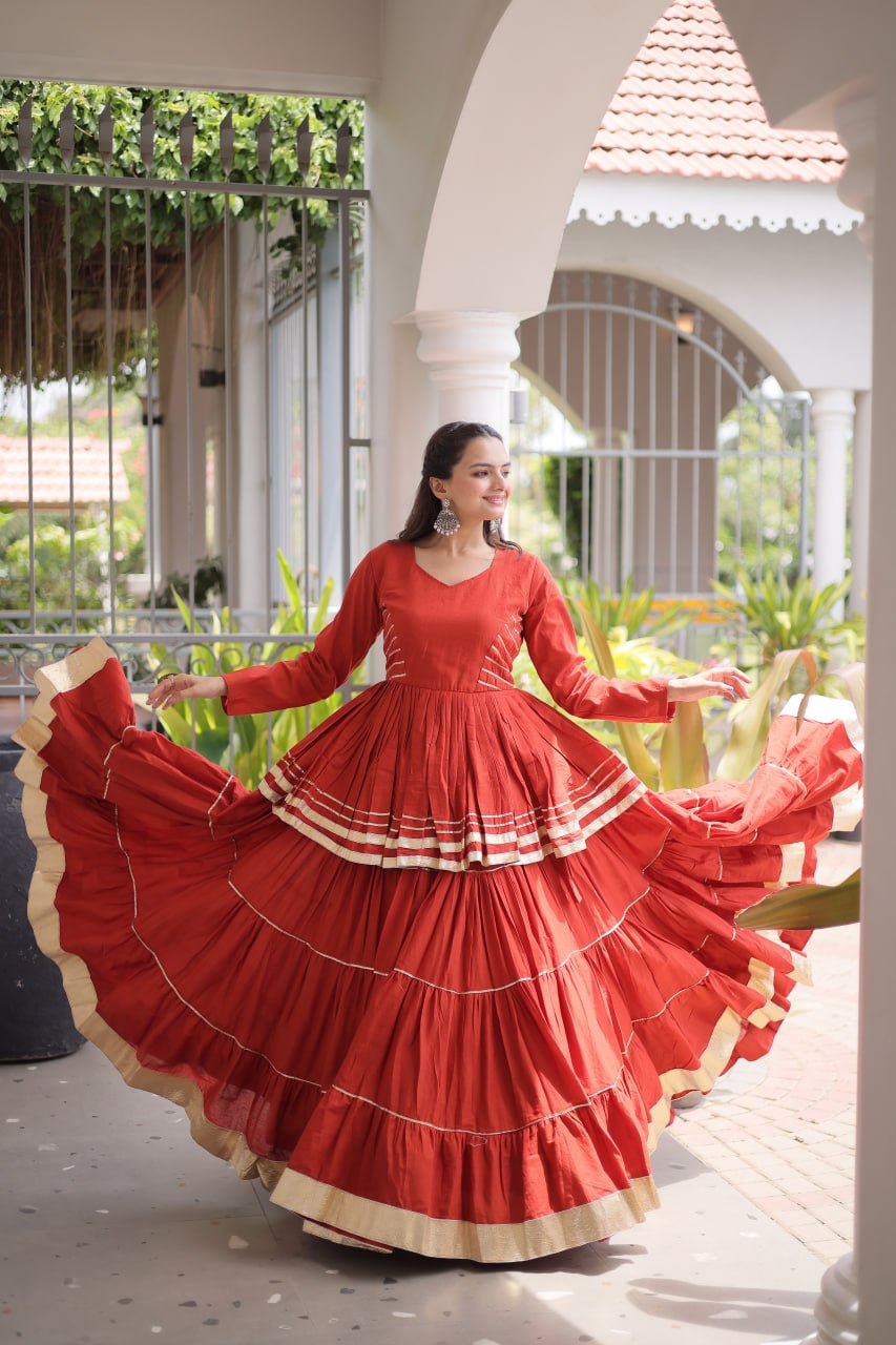 Navratri Rust Orange Kora Cotton Multi-Tiered Flared Lehenga Set with Peplum Top & Metallic Gota Patti Lace Work