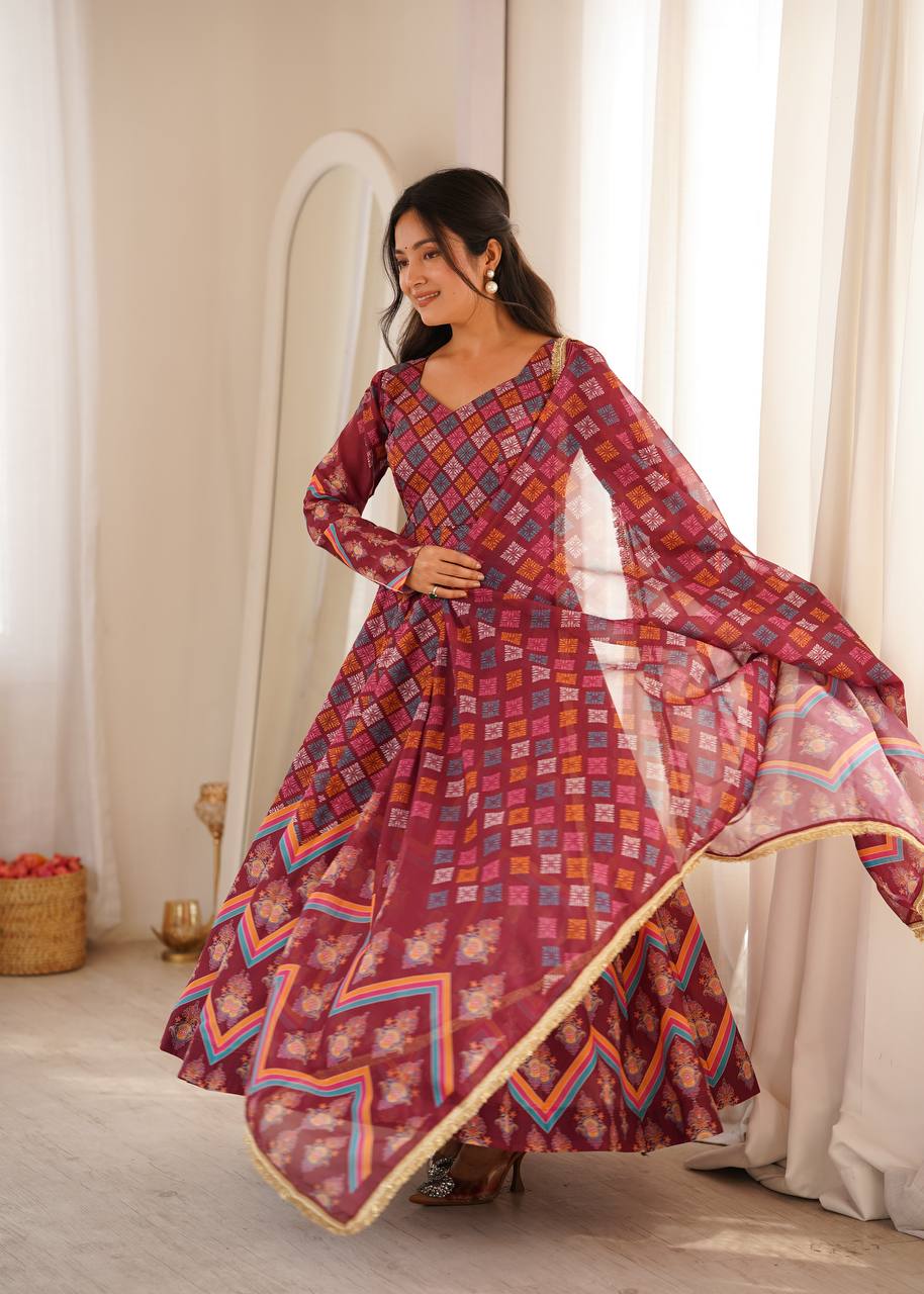 Wine Maroon Printed Muslin Cotton Anarkali Gown Suit Set with Traditional Patola Geometric Print, Matching Pants & Printed Tabby Organza Golden Lace Dupatta