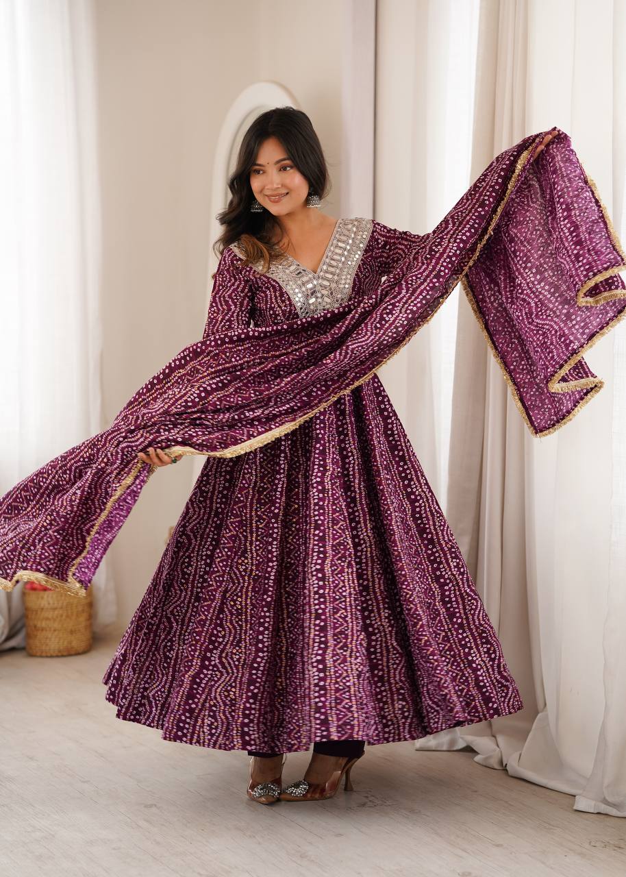Wine Purple Rayon Bandhani Print Anarkali Gown Suit Set with Heavy Real Mirror Embroidery V-Neck Yoke, Matching Pants & Golden Lace Rayon Dupatta (2.3M)