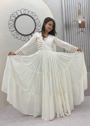 Off-White Pure Cotton Navratri Special Tiered Anarkali Gown with Gota Work and Hanging Tassels by The Beauty Queen