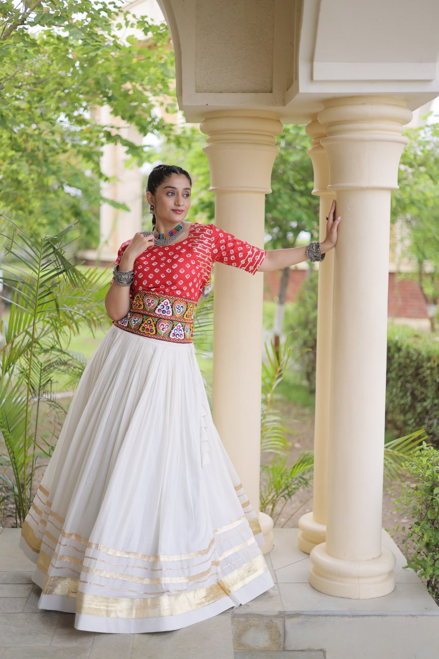 Navratri Off-White Kora Cotton Flared Lehenga Set with Gota Patti Lace Work & Festive Red Bandhani Embroidered Blouse