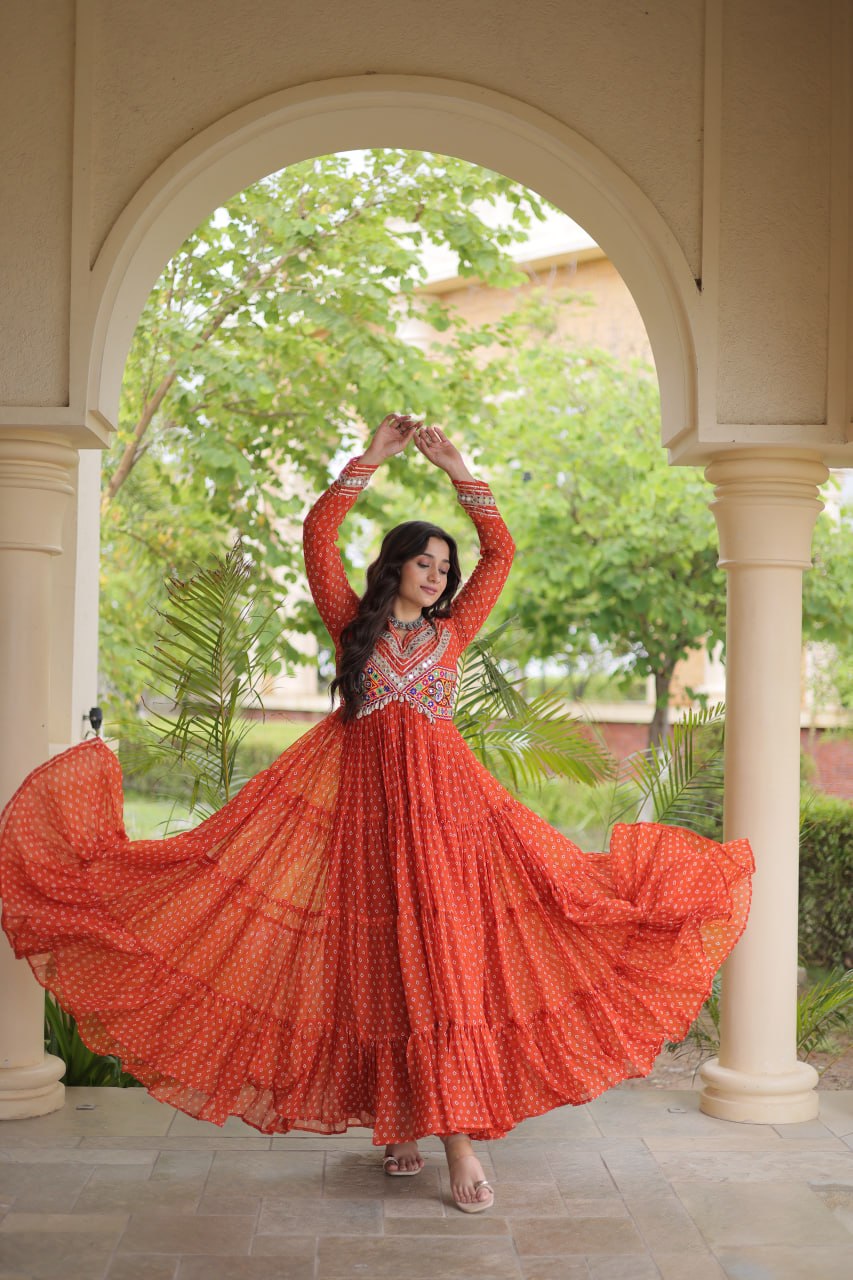 Rust Orange Faux Georgette Bandhani Print Navratri Gown with Kutchi Patchwork & Cowrie Shells