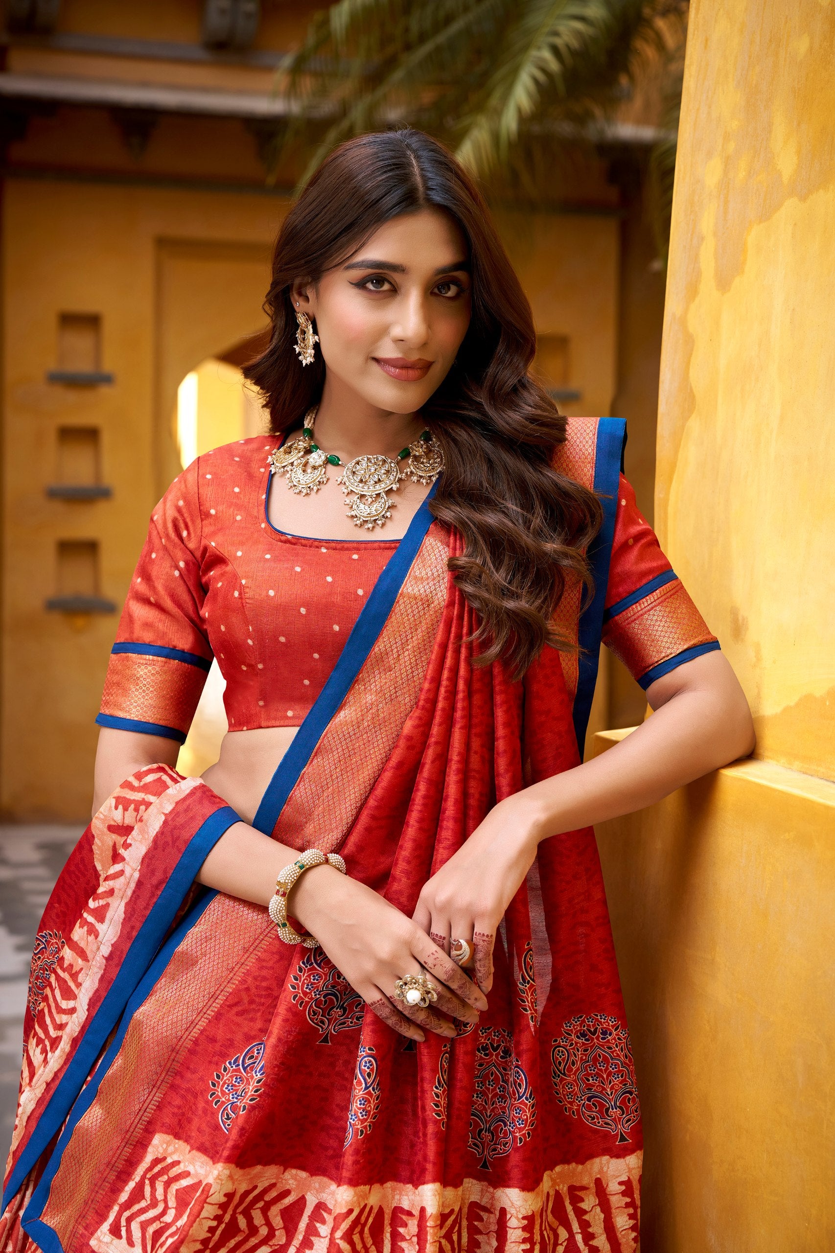 Rust Orange Dola Silk Half Saree Lehenga Set with Traditional Batik Print, Rich Zari Weaving Border & Royal Blue Piping Accent