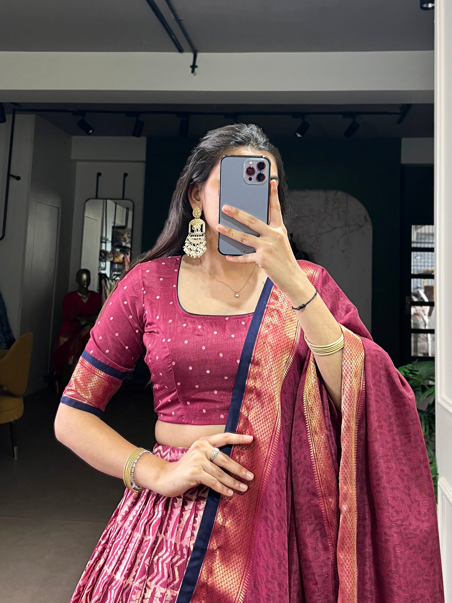 Magenta Wine Dola Silk Flared Lehenga Choli Set with Traditional Batik Print, Rich Zari Weaving Border & Matching Printed Dupatta