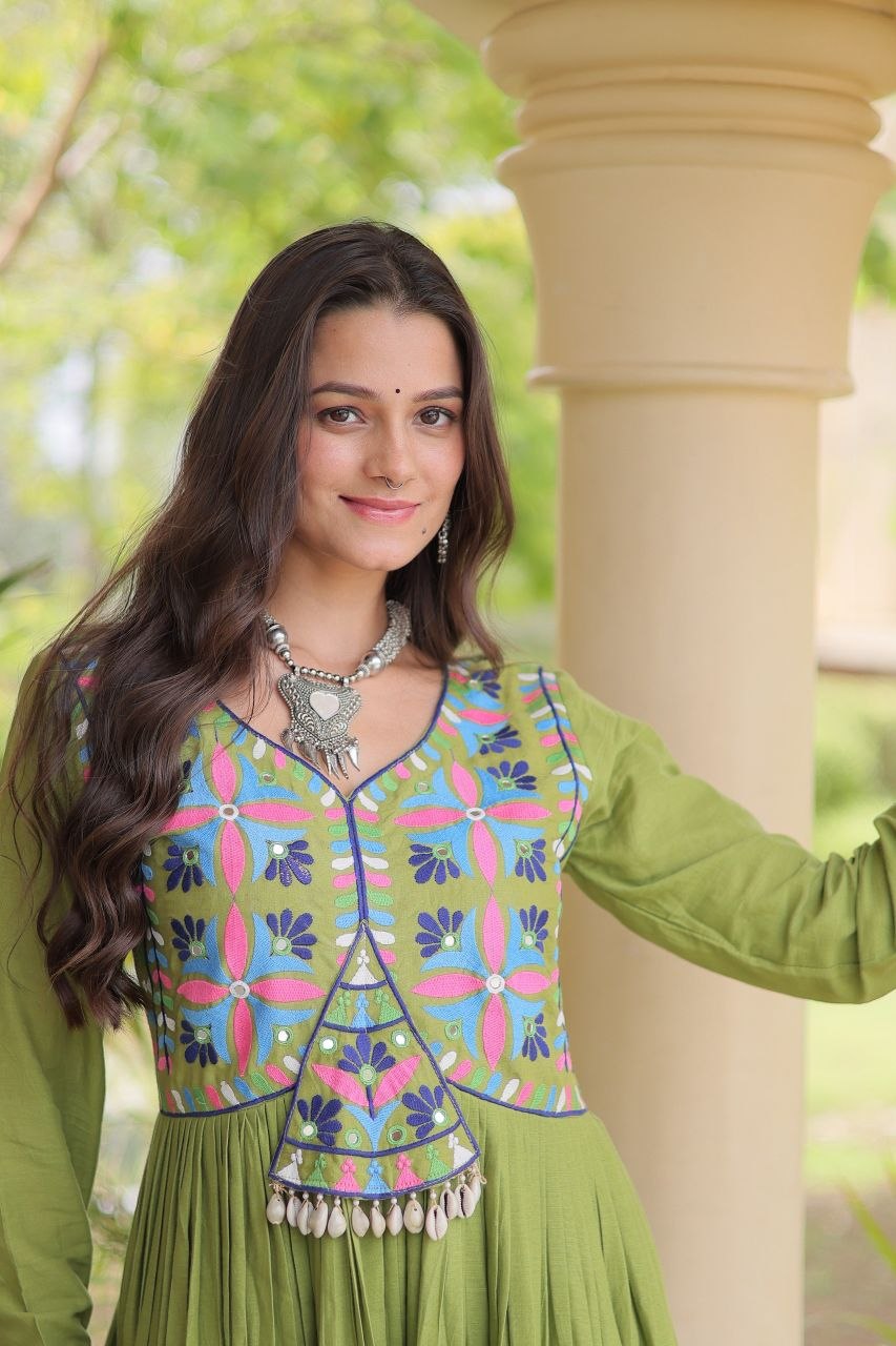 Navratri Pista / Olive Green Kora Cotton Full-Flared Anarkali Gown with Multi-Thread Folk Embroidery, Gota Patti, Real Mirror & Cowrie Shell (Codi) Lace Work
