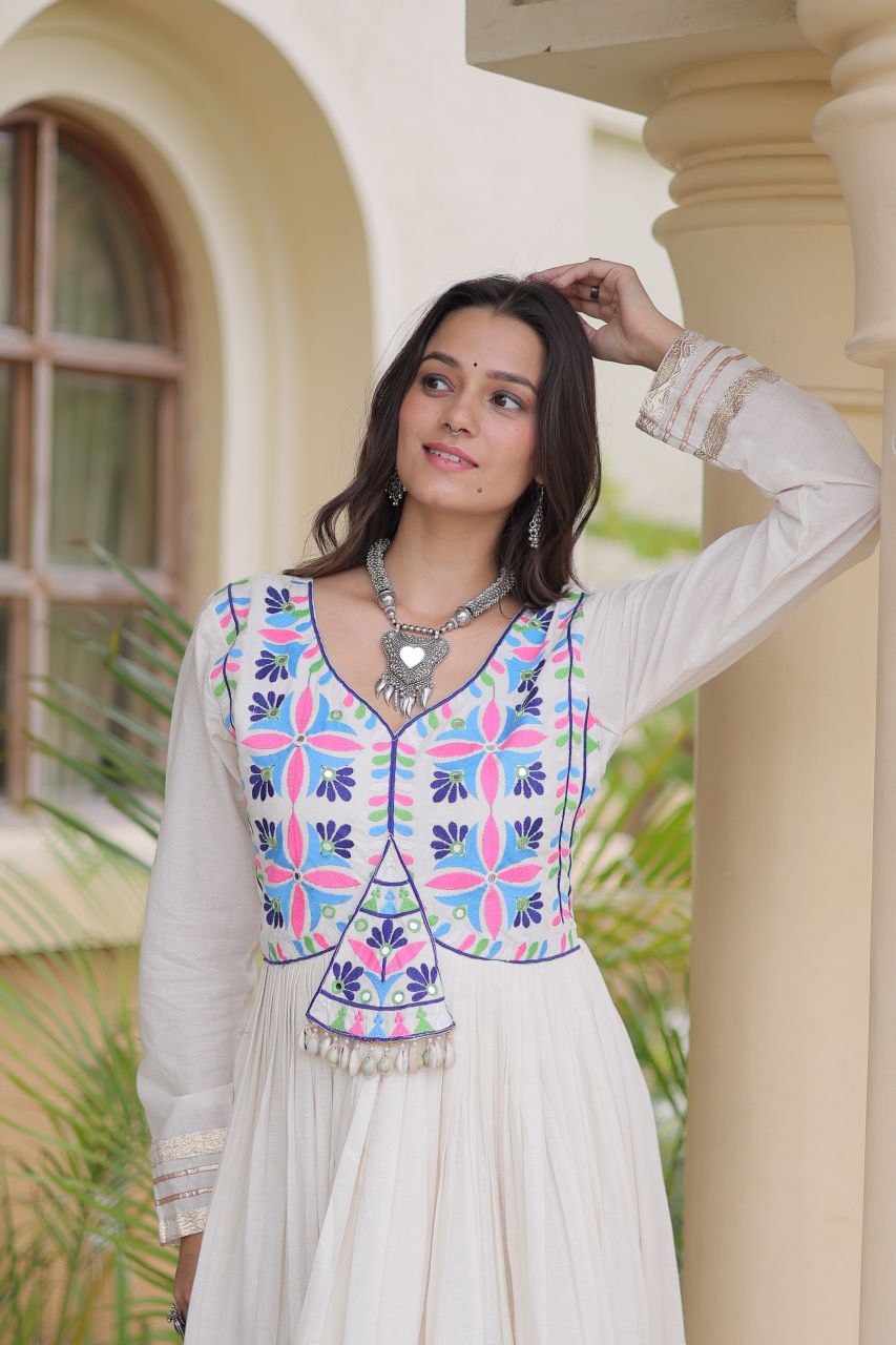 Navratri Off-White Kora Cotton Full-Flared Anarkali Gown with Multi-Thread Folk Embroidery, Gota Patti, Real Mirror & Cowrie Shell (Codi) Lace Work