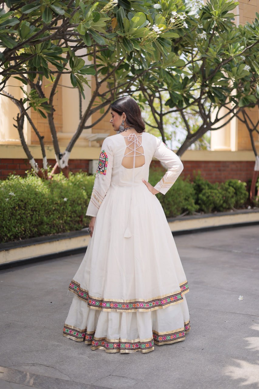 Navratri Off-White Kora Cotton Flared Lehenga Set with Front-Slit Long Shrug/Koti, Gamthi Embroidery & Gota Patti Lace Work