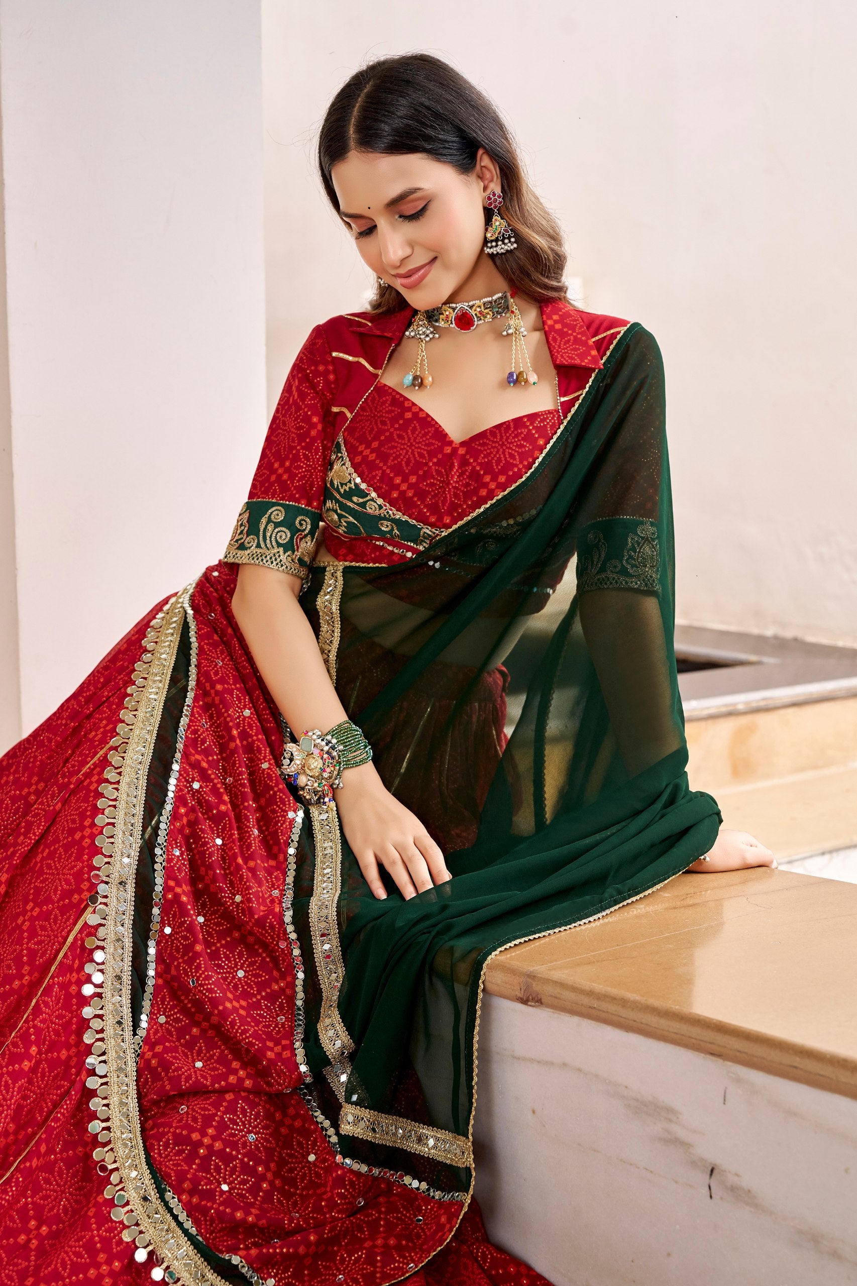 Navratri Maroon Red Georgette Bandhej Foil Print Flared Lehenga Choli with Embossed Emerald Green Border & Gota Patti Lace Work