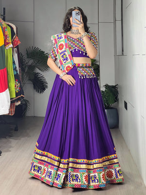 Model Wearing Purple Pure Rayon Cotton Gamthi Patch And Mirror Work Border Navratri Lehenga Choli Set With Dupatta By The Beauty Queen