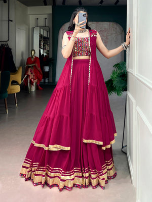 Model wearing Rani Pink Lightweight Lehenga, Gamthi Blouse, Gotta Patti Lace Detailing, And A Mirror-adorned Long Koti Navratri Lehenga Choli Set by The Beauty Queen